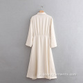 Gaun long wanita gaun putih krim-putih dengan kancing